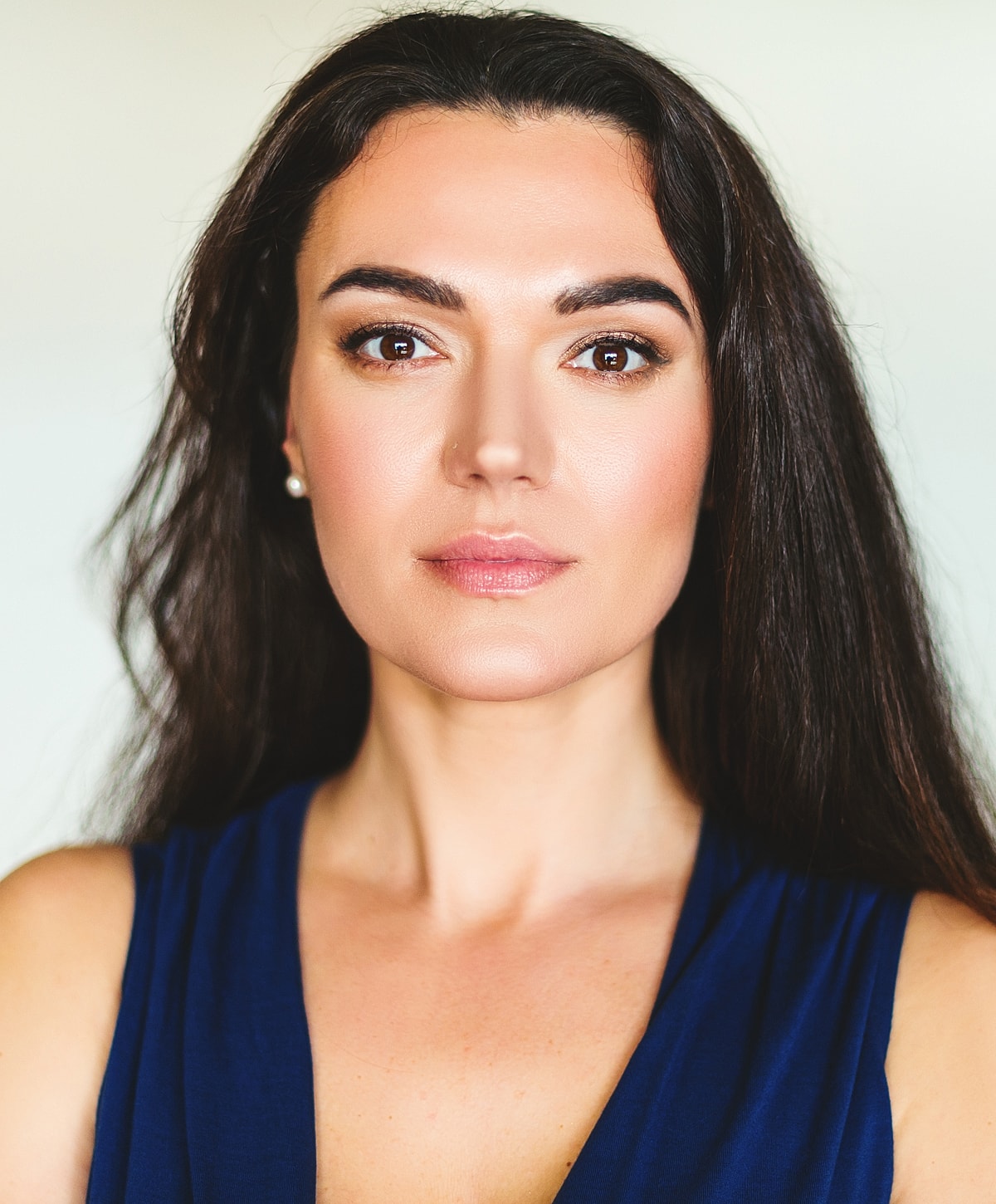 Portrait of a woman with long dark hair.