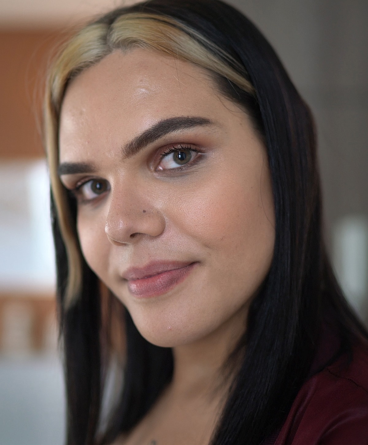 Close-up portrait of a person with dark hair.