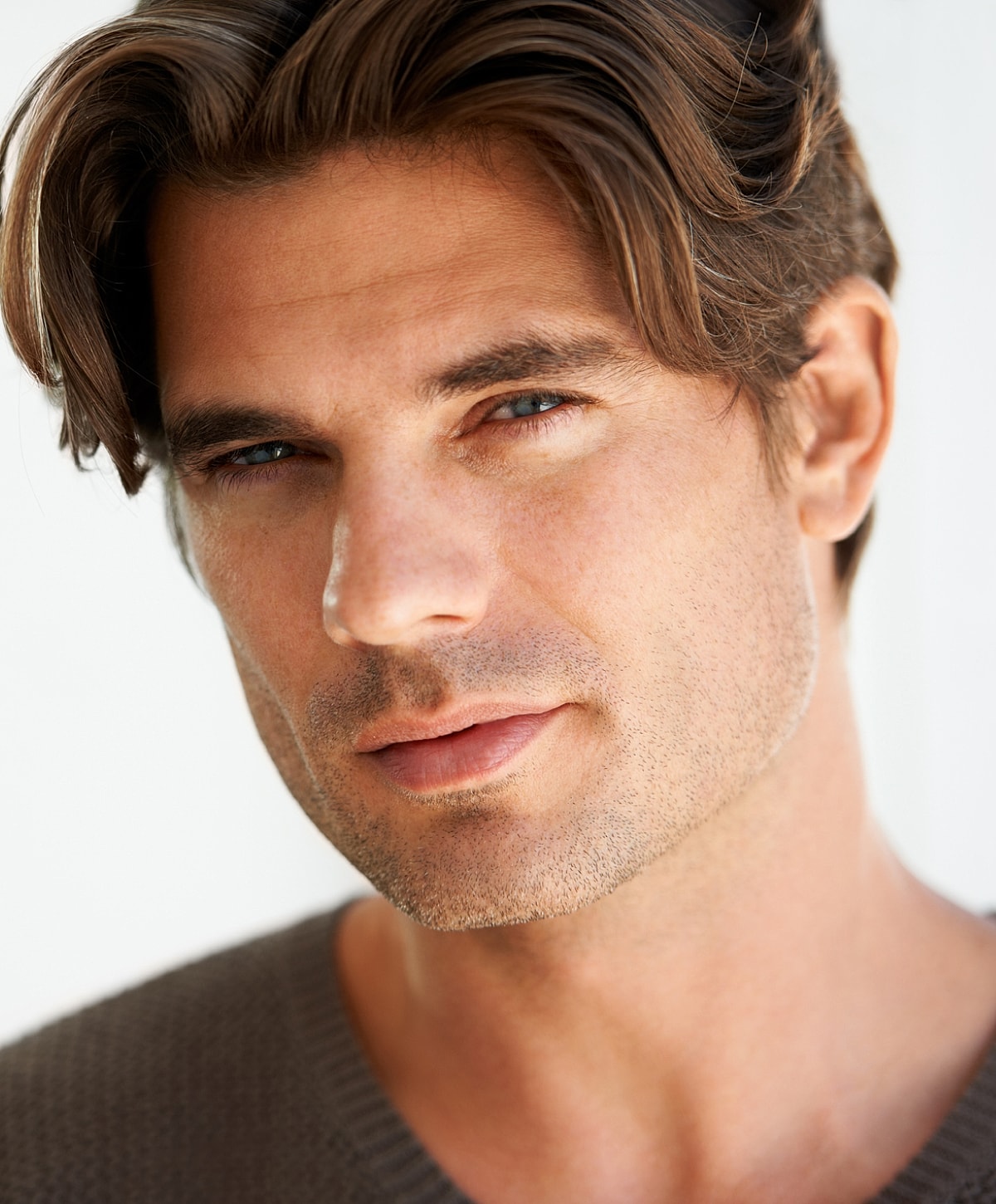 Close-up of a man with stylish hair.