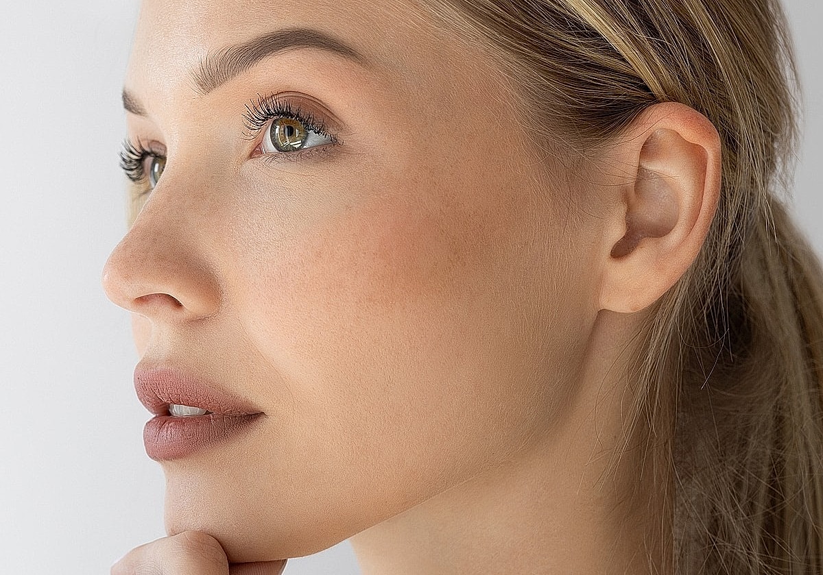 Profile of a thoughtful woman with natural beauty.