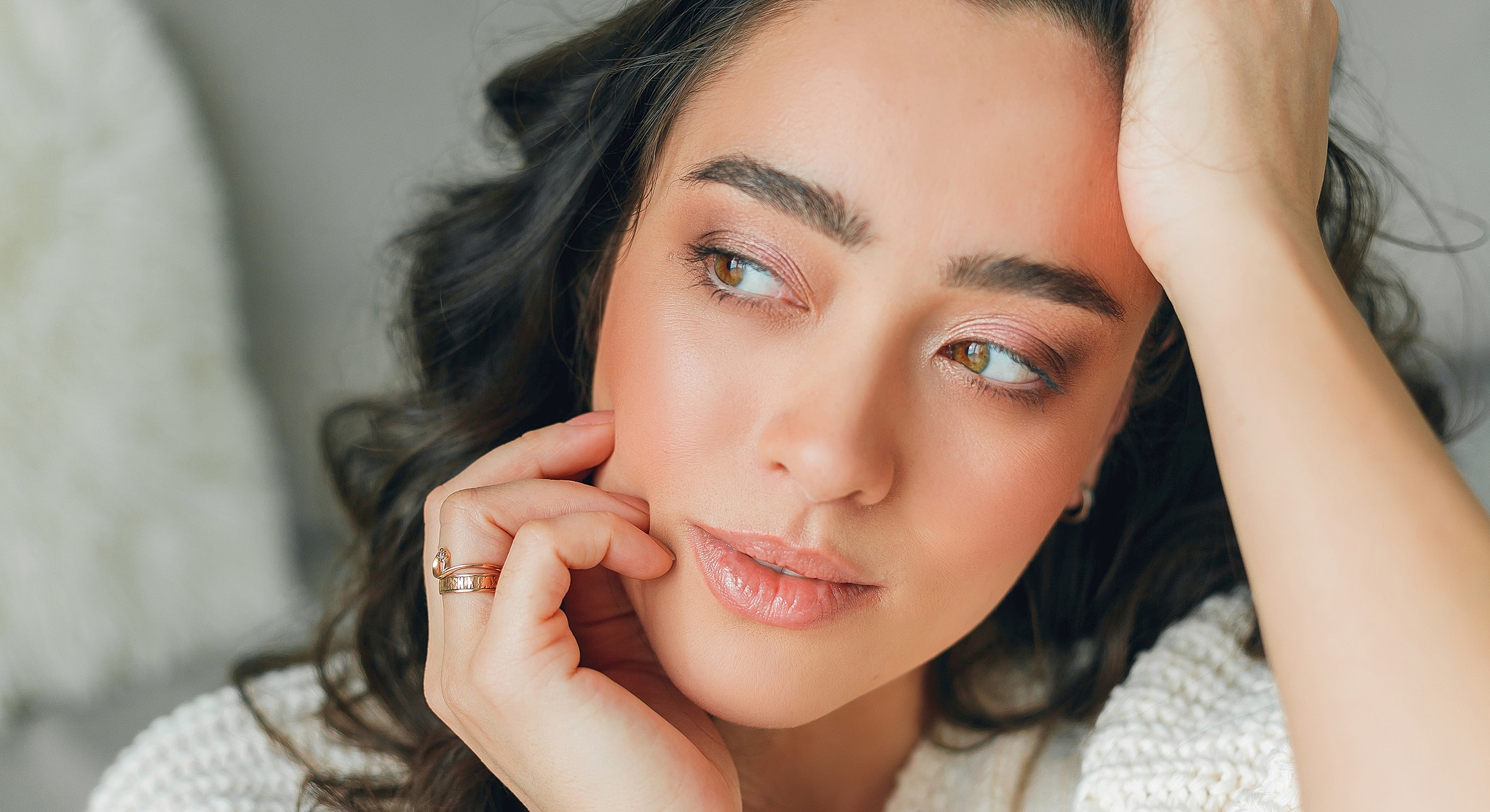 Close-up of woman with natural makeup expression.
